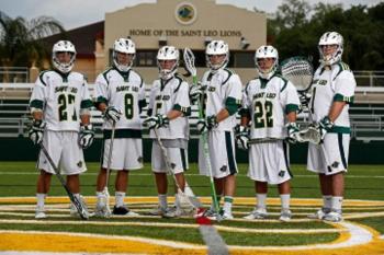 lacrosse team posing on the field