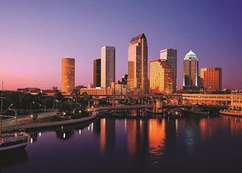 dusk view of a downtown skyline near water