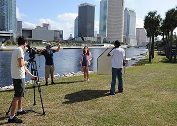 students filming a project outdoors