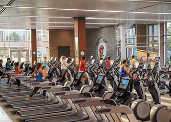 people using treadmills in a fitness center