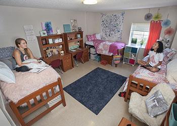 students in a dorm room with decorations