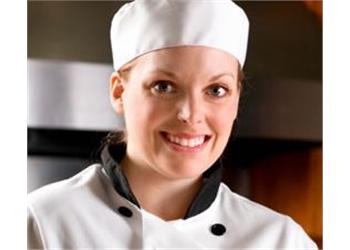 smiling chef in professional kitchen attire