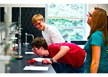 students conducting an experiment in a lab