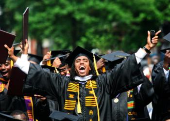 graduates in caps and gowns celebrating