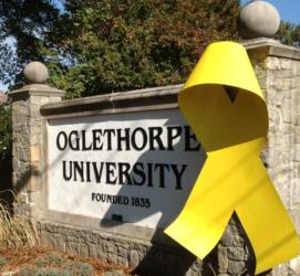 sign with 'oglethorpe university founded 1835' partially covered by ribbon