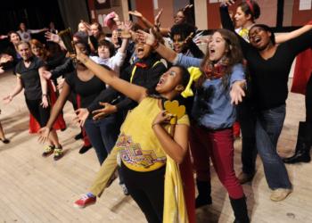 group of students performing on stage