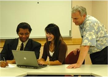 students and teacher with laptop