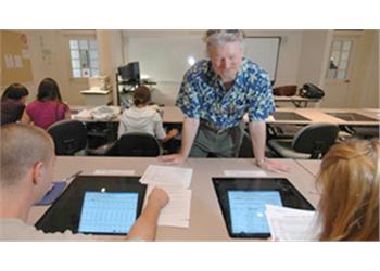 teacher using tablet in classroom