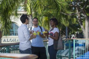 students by aloha tower, sunny day