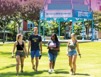 students walking, 'Welcome HPU Students!' banner