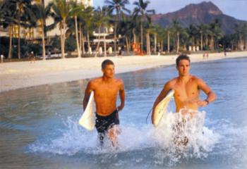 students surfing, beach setting