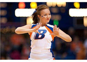 cheerleader with 'boise state' on uniform clapping hands