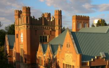 sunlit historic university building with turrets