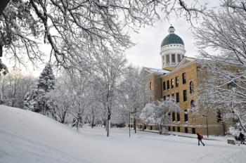 campus building with dome in snow