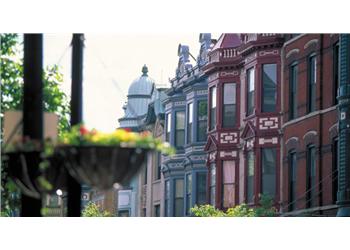 historic urban street lined with colorful buildings