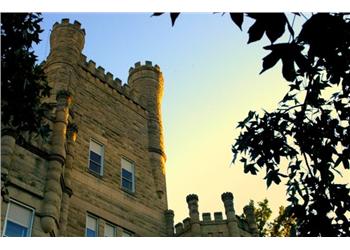 castle-like building with turrets at dusk