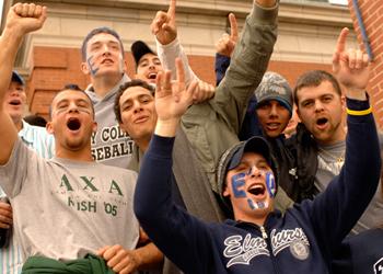students cheering at an outdoor event
