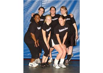 group of athletes posing in sports attire