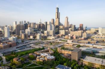 aerial view of campus with chicago skyline in background