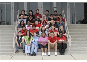 group of students sitting on steps