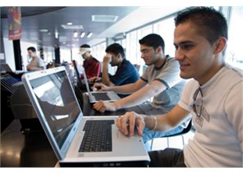 students using laptops in an educational setting