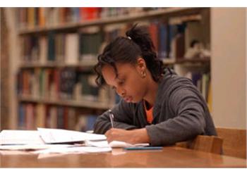 student studying in library