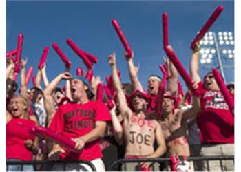 fans in red holding foam fingers cheering