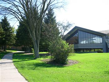 lush lawn with modern building and pathway