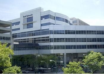 modern university building with trees in foreground