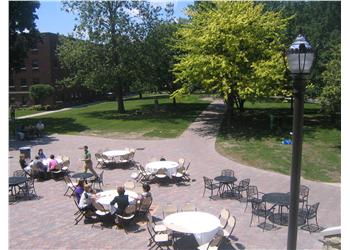 outdoor campus dining area with tables and chairs