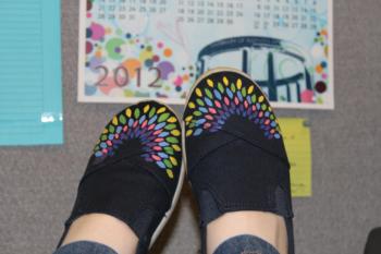 person wearing shoes with colorful pattern