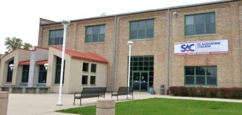 front entrance of 'St. Augustine College' with banners