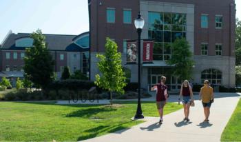 students walking near a university building