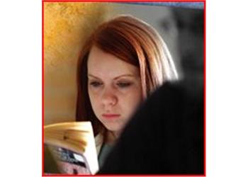 woman reading a book intently