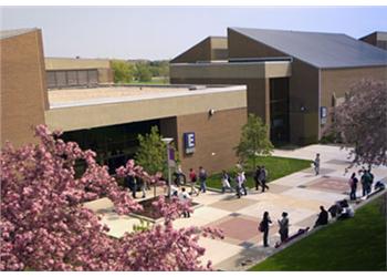 students walking outside a campus building