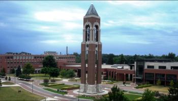 bell tower with clouds in the sky