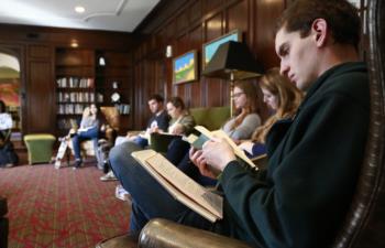 students reading in a classic room