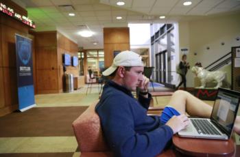 student studying in a lounge area