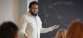 professor teaching physics in a classroom