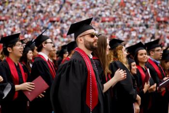 graduates in caps and gowns at ceremony