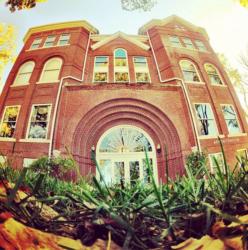 fisheye lens view of a brick building with arched entryway