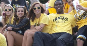 group of students wearing 'cloud nine' t-shirts smiling