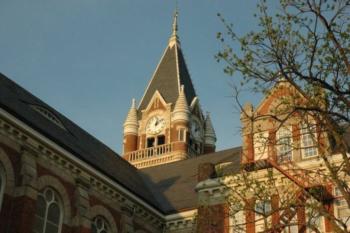 historic building clock tower with trees