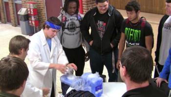 teacher conducting a science experiment for students