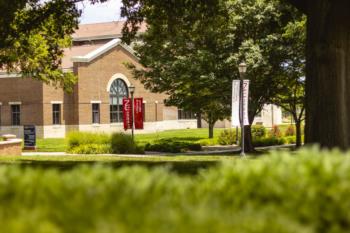 campus view with 'newman university' banners