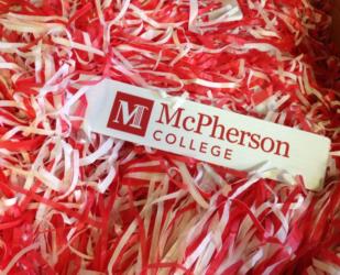 mcpherson college logo on shredded paper