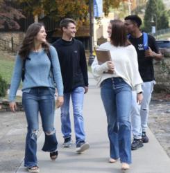 students walking and talking on campus