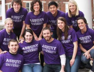 group of students wearing 'asbury university' t-shirts smiling