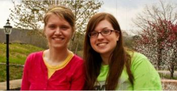 two smiling women outdoors