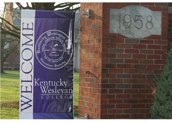 welcome banner and brick wall with '1958'